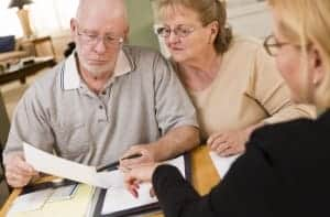 Couple reviewing Paramount Builders financing form