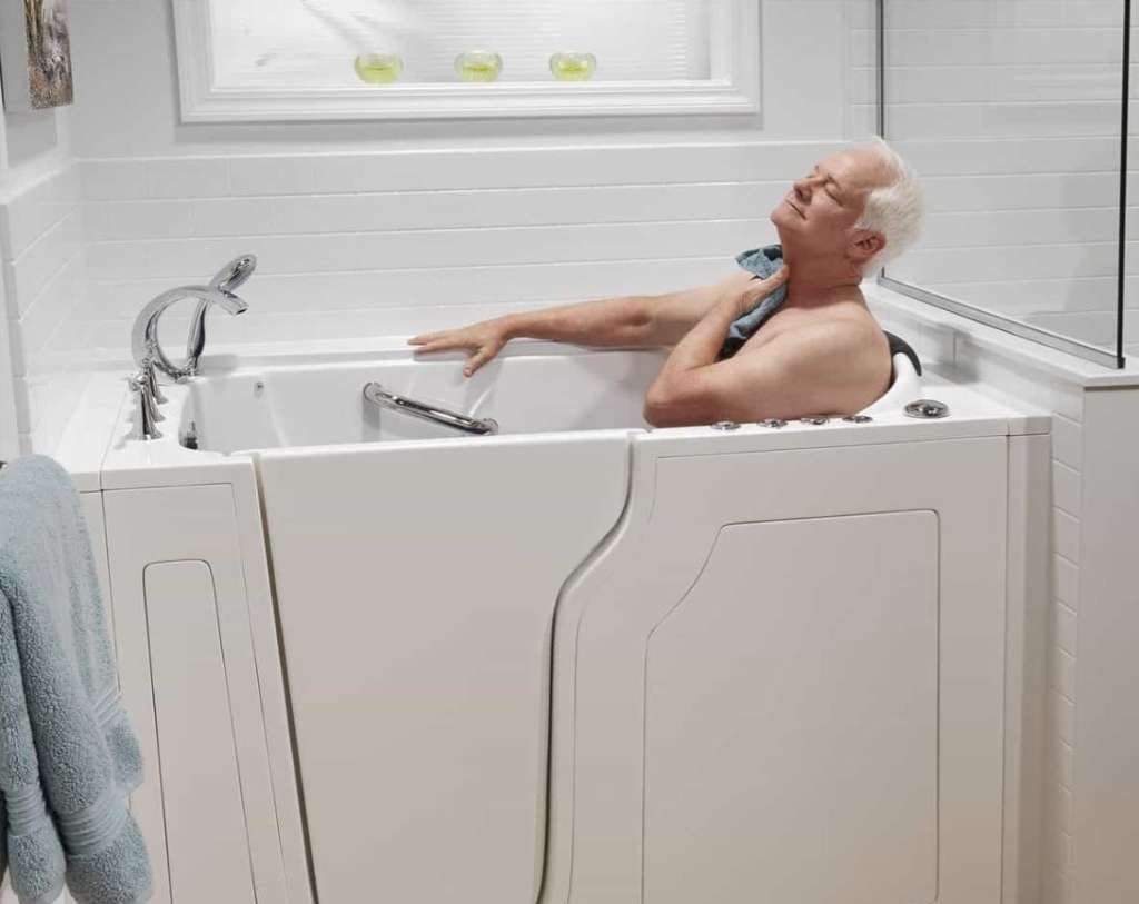 Man bathing safely in a walk-in bath